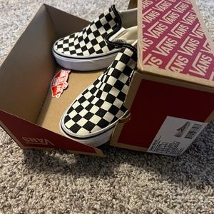 Classic checker Vans slip-ons